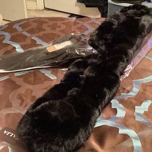 Fur scarf with ball and satin gloves with fur at wrists.